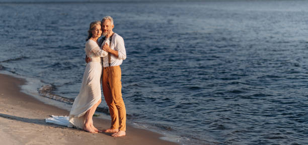 istock Senior newlyweds hug. 1383488252