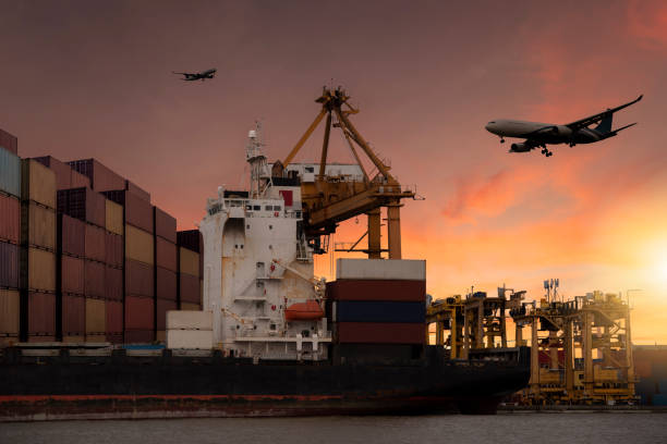 istock Cargo planes flying over container berths and berths. It is used for transportation and freight logistics industry in the capital city. 1383488323