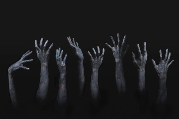 istock many scary and creepy zombie hands raising from darkness 1383489457