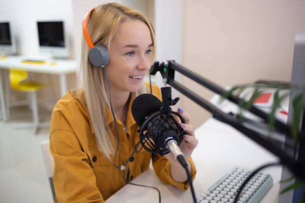 istock young woman is streaming while sitting in coworking at the computer 1383489726
