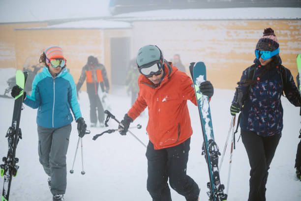 istock people skiing under the blizzard weather conditions 1383489759