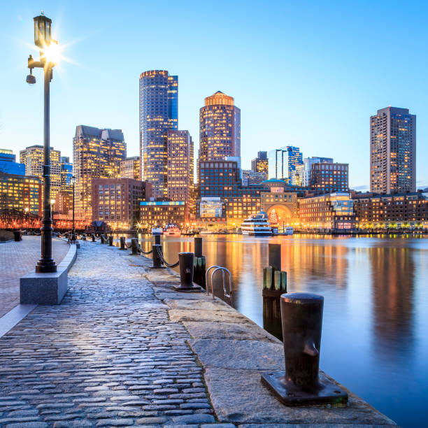 Boston View of the historic city of Boston in Massachusetts, USA showcasing its mix of contemporary and colonial buildings at Boston Harbor and Financial District. boston harbor stock pictures, royalty-free photos & images