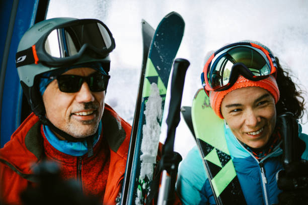 istock skiers at the gondola going to the track 1383490663