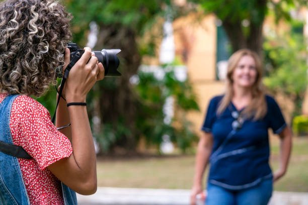 istock Young woman photographing. 1383490963