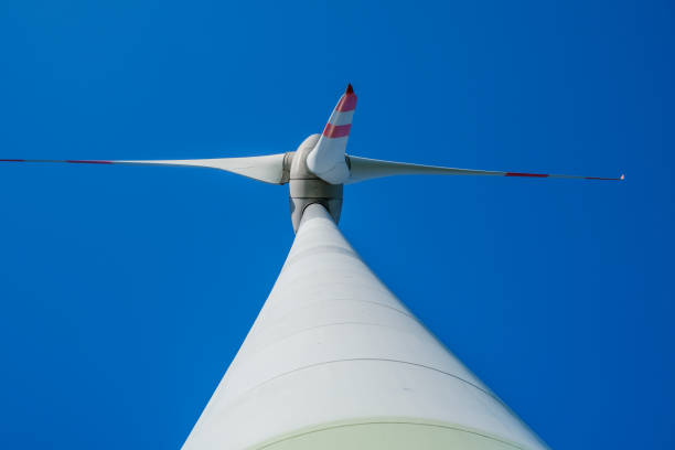 istock wind turbine photographed from bottom to top with blue cloudless sky 1383494763