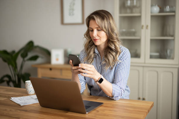 istock Woman  manage household finances in kitchen 1383497662