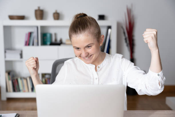 istock Front view of woman celabrating success 1383498821