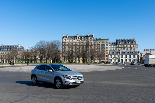 Roundabout on Esplanade des Invalides and traffic around the roundabout in the foreground in Paris, France, Europe.