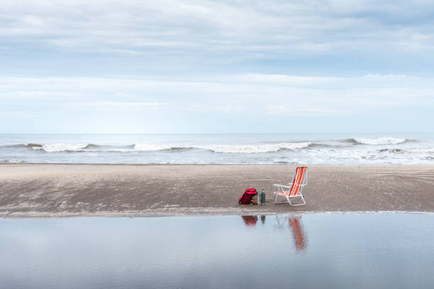 Lounge Chair at Ocean Edge on White Sand Beach in Caribbeans