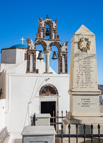War Memorial for Balkan & Greek Turkish Wars at Church of Agios Nikolaos (St Nicholas) in Pyrgos Kallistis on Santorini, Greece, with names visible.