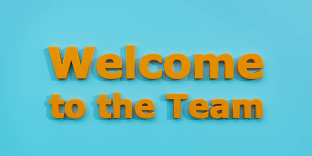 istock Welcome to the team. Orange letters against a blue background. 1383506748