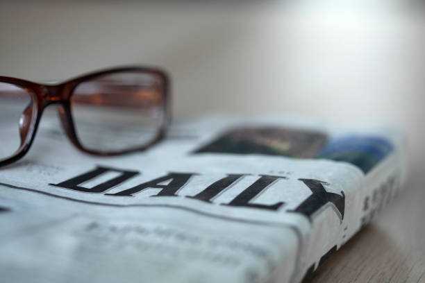 istock newspaper and glasses 1383507946