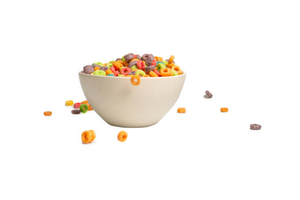 istock Colorful cereal box for morning breakfast. Corn flakes falling to the white bowl. Motion. 1383510286