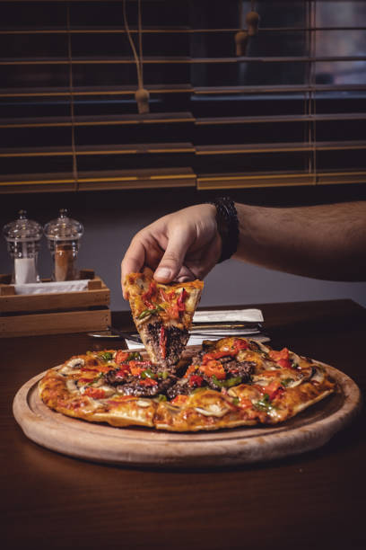 istock Slice of pizza with mincemeat 1383511992