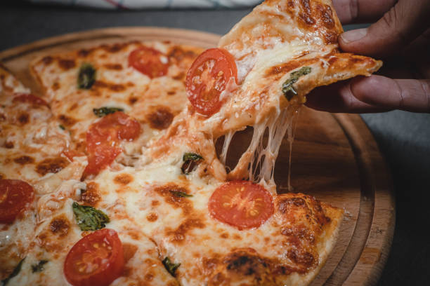 istock Slice of margherita pizza 1383512512