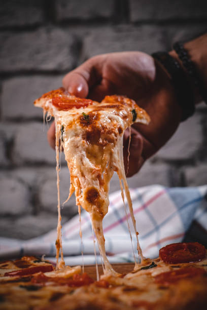 istock Slice of margherita pizza 1383512544