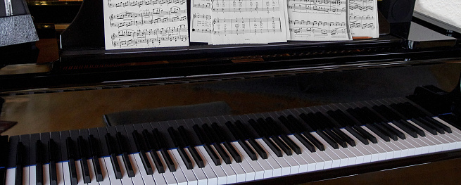 Piano keys and music sheets