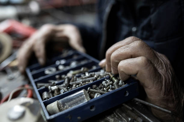 Active senior man fixing electronic tools
