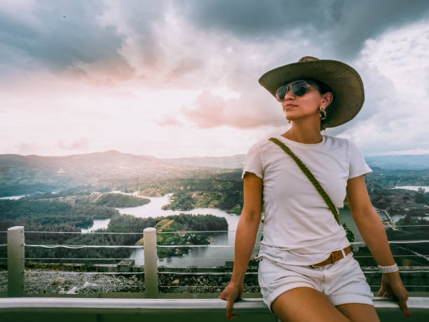 Latin Woman with hat and sunglasses stock photo
