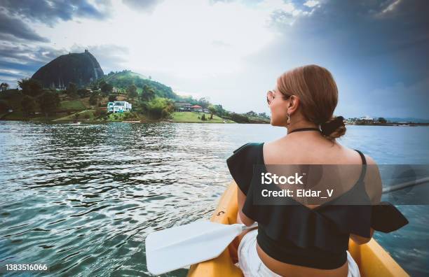 Latina Woman Traveling In A Kayak Stock Photo - Download Image Now - Lake, Latin American and Hispanic Ethnicity, One Woman Only