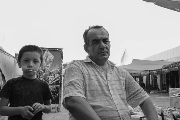 24 june 2021 Uzbekistan Samarkand city local man and his boy in Siab Bazaar