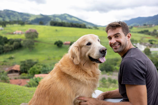 istock Happy man spending time outdoors with his dog 1383517035