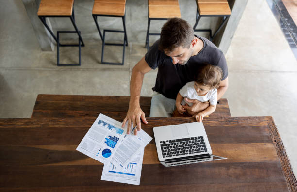 istock Stay-At-Home Father working at home 1383517061