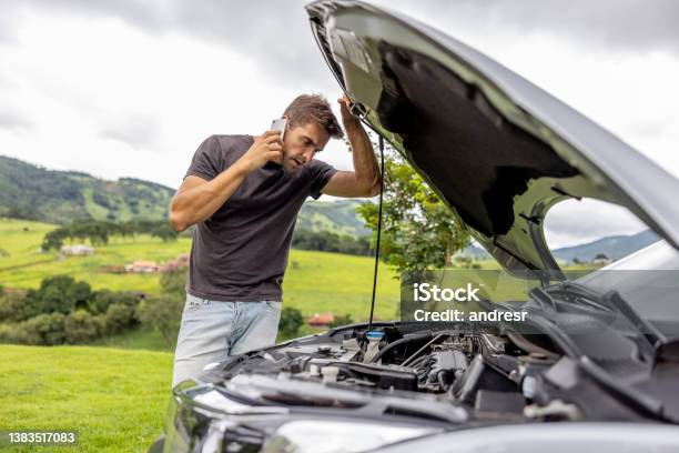 Man Calling His Car Insurance After Having A Vehicle Breakdown On The Road Stock Photo - Download Image Now