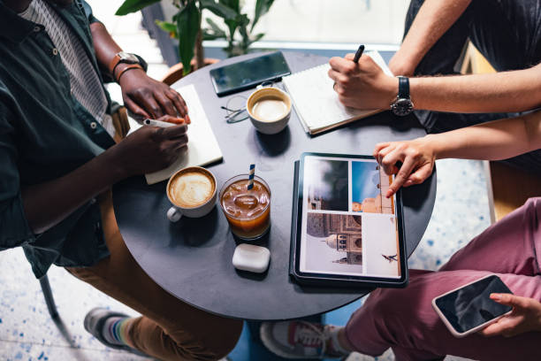 istock An Anonymous Group of People Using Digital Tablet and Notebooks for Planing Next Trip Together 1383519599