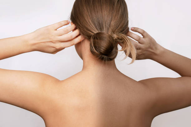 istock Young woman standing with her back before and after tanning isolated on a white background 1383519829