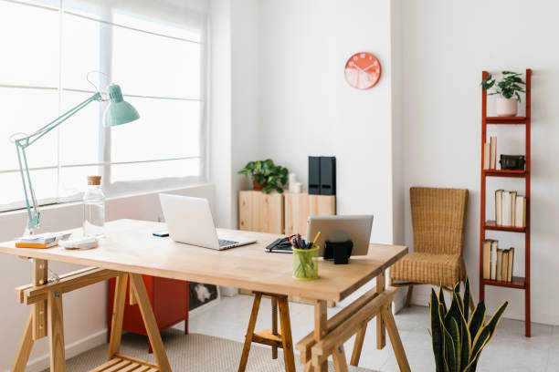 istock Home office workspace with laptop computer and office supplies 1383525409