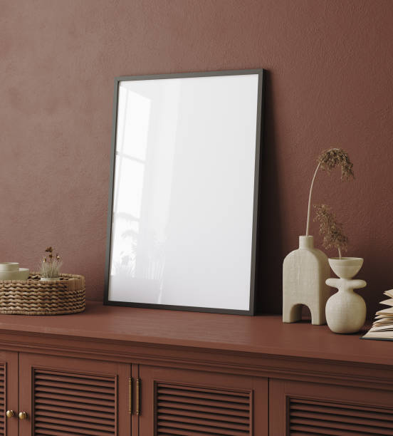 istock Mock up poster frame on commode with flowers in interior background 1383525564