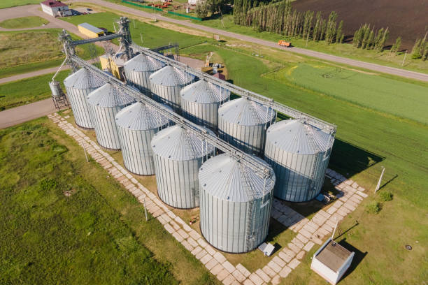 istock Round aluminum granaries. Large silver bins for processing grains 1383528624