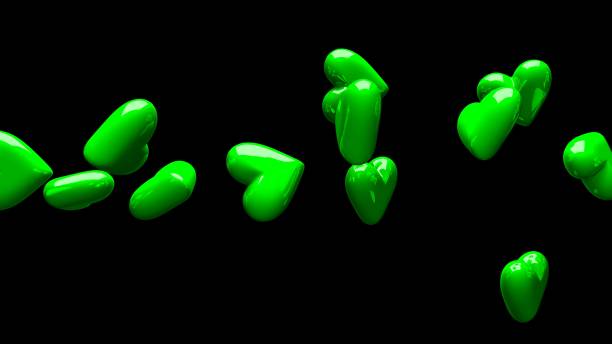 istock Green hearts on black background. 1383528778
