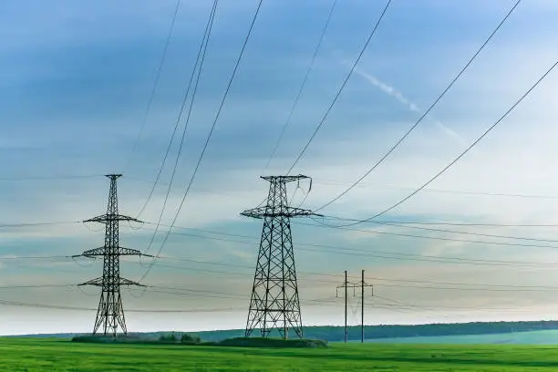 Photo of High-voltage power lines. Electricity distribution station. high voltage electric transmission tower