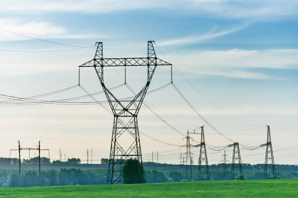 istock Industrial high voltage electricity line tower. 1383528907