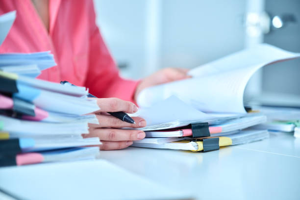 istock Accountant woman checking report for analysis information. 1383529731