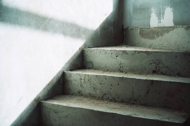 istock concrete steps in the house just after formwork removal and wall with bright sunlight and shadow 1383530486