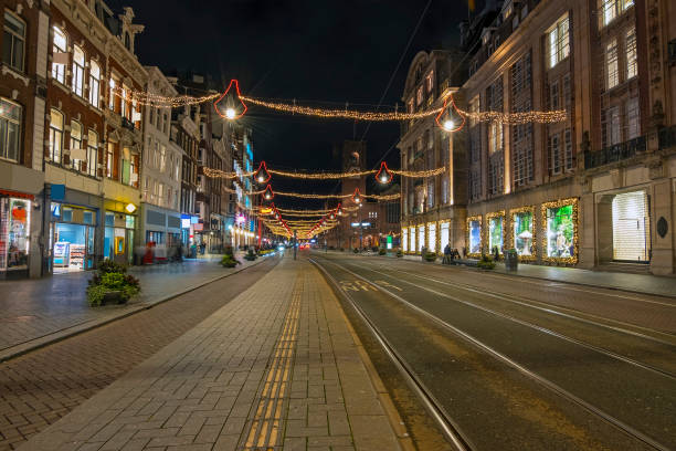 istock Christmas on Damrak in Amsterdam the Netherlands at night 1383530588