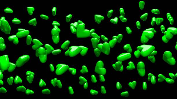 istock Green hearts on black background. 1383531990