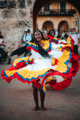 Cartagena, Colombia - February 18, 2022.Colombian folklore group dancing  in front of the entrance of the old city in Cartagena de Indias, Colombia.