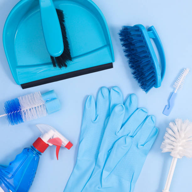 istock Pastel blue background with cleaning tools for domestic house works. Flat lay 1383535522