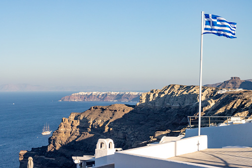 Greek Flag on Santorini Caldera in South Aegean Islands, Greece