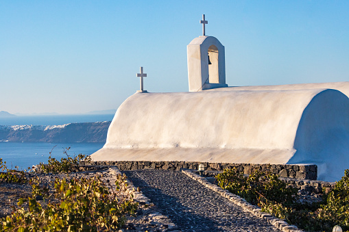 Santorini Greece, Church of Panagia Platsani. Blue cupola and white washed walls, Greek landmark.