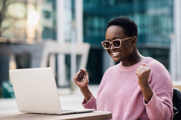 istock Beautiful black businesswoman ecstatic 1383539534
