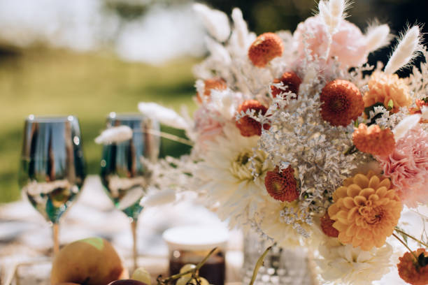 istock Holiday dinner in the garden. Beautiful wedding festive table for two 1383544894