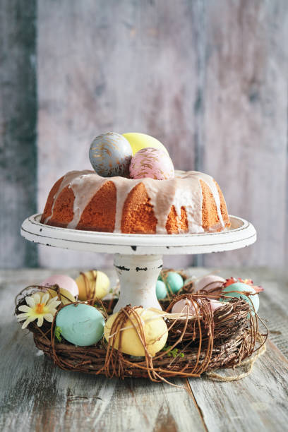 Bundt Cake with Easter Eggs Bundt Cake with Easter Eggs easter cake stock pictures, royalty-free photos & images