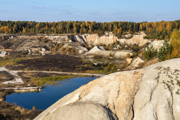 istock Abandoned chalk quarry with big mountains and blue lake 1383548163