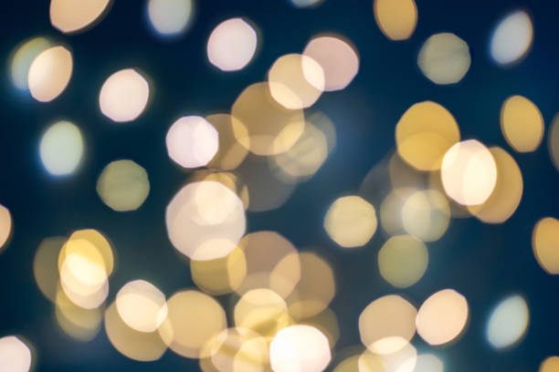 istock Yellow festive blurred lights on blue background 1383548355