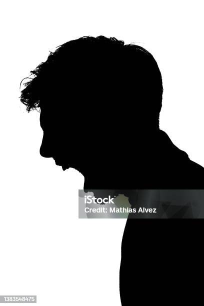 Backlight Portrait Silhouette Angry Screaming Young Man In Profile Stock Photo - Download Image Now
